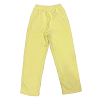 A pair of light yellow athletic pants with an elastic waistband and small white embroidered logos near the lower hems, shown flat against a white background.
